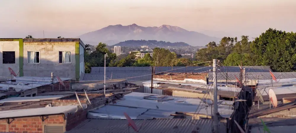 San Salvador buildings with volcanic hills in El Salvador