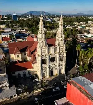 View of Santa Ana in El Salvador with historic buildings and surrounding volcanic hills