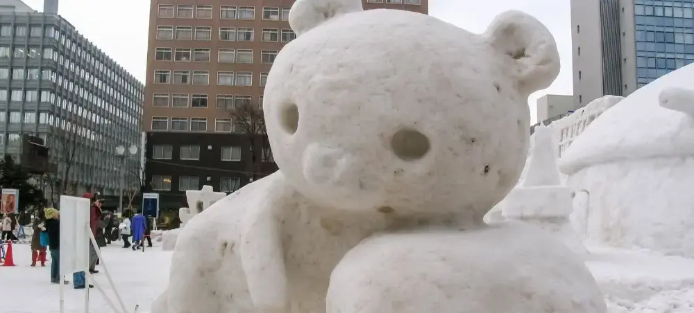 Snow and ice sculptures featuring a giant bear snow sculpture at Sapporo Snow Festival in Odori Park