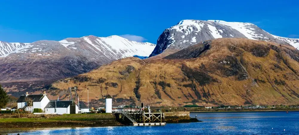 Snow-capped Ben Nevis towering over Loch Linnhe near Fort William, gateway to Scottish Highlands private jet destinations