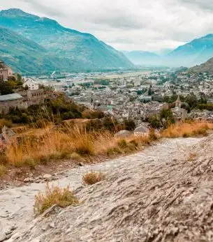 Panoramic view of Sion, Switzerland, with medieval Valère Castle overlooking the Alpine valley, a key destination for private jet charter via Sion Airport
