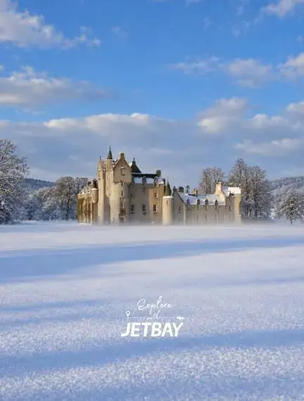 Stone façade and landscaped gardens of Ballindalloch Castle in Speyside