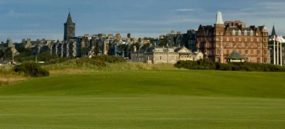 St Andrews Old Course fairway with the iconic clubhouse and historic town skyline visible in the background on a clear day