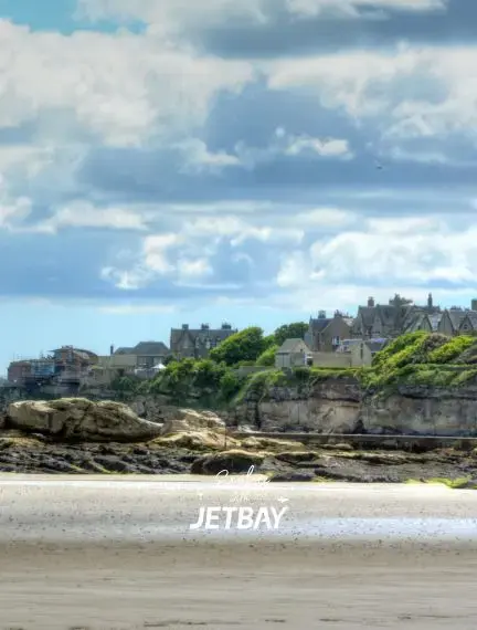 Wide sandy shoreline of West Sands Beach beside the golf links at St Andrews