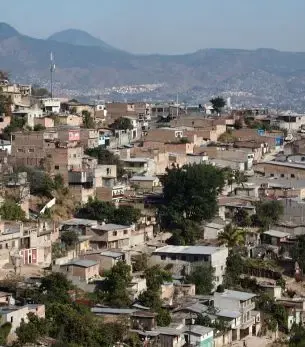 Aerial view of Tegucigalpa, Honduras, with hills and dense city streets below