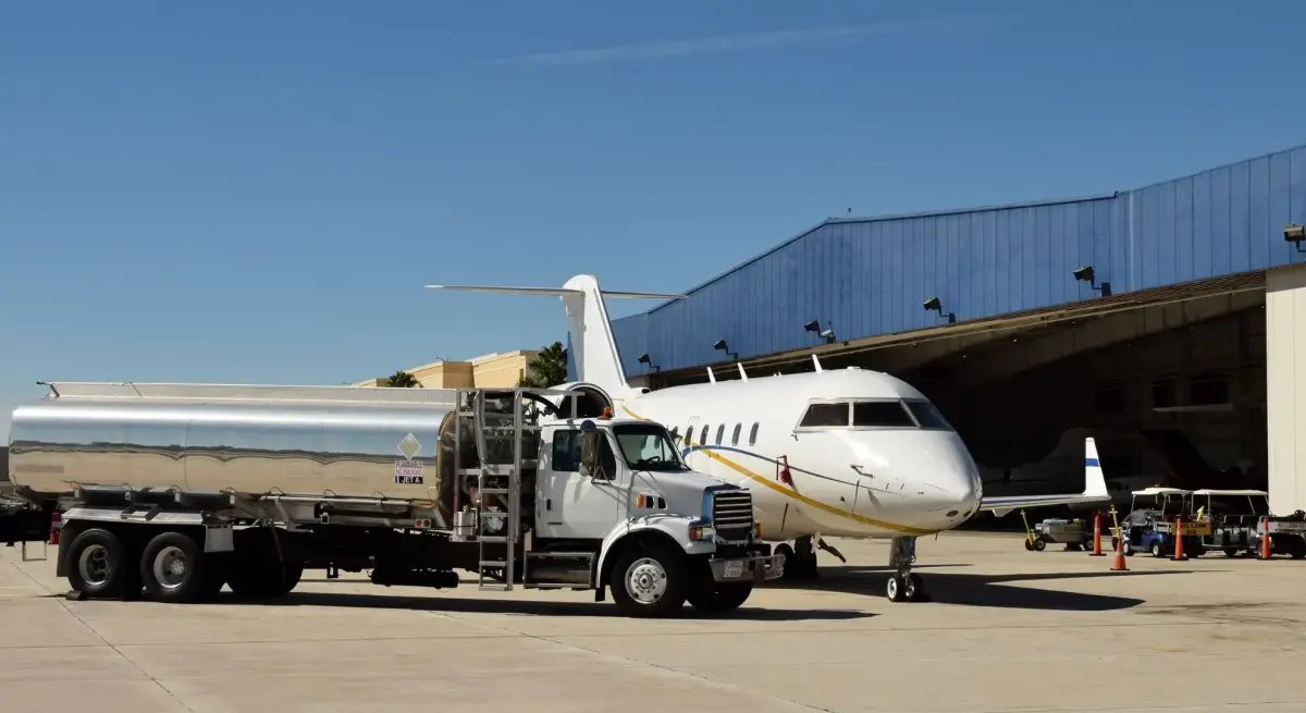 Private jet being refueled at airport hangar for sustainable aviation