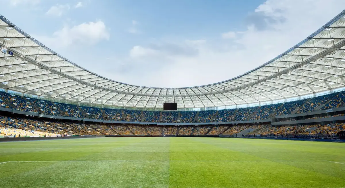 Empty football field, representing World Cup travel